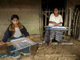 Young Q'eqchi'-speaking Maya girls learn picb'il weaving at home in Alta Verapaz.
