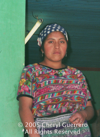 María Estela Puac Tzunun, 17, ties jaspe patterns for a living, bringing in cash for her rural family.   Photo by Cheryl Guerrero 2005.