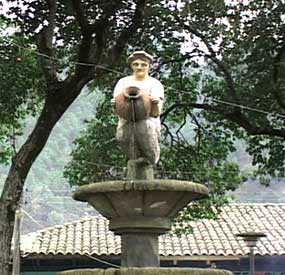 The statue in the center of San Ildefonsoo Ixtahuacán is of a woman in traje feeding the fountain with her water jug. Photo Kathleen Mossman Vitale 2005.
