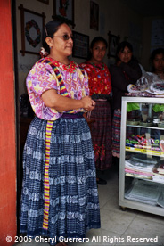 The traje of San Juan Ostuncalco often includes colorful randas or embroidered bands that join panels on both huipiles and cortes.  Photo by Cheryl Guerrero 2005.