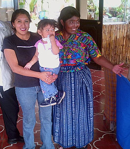 Alida Pérez, leader of a 3000-member artisan cooperative and owner of the Museo del Tejido in Antigua, is pictured with her daughter Jacqueline Anneta and granddaughter Alessandra.  Photo by Paul G. Vitale 2005.