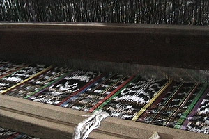 Carlos is weaving a double jaspe or ikat pattern in which both warp and weft have been tied and dyed prior to use on the loom.  Photo by Kathleen Mossman Vitale 2004.