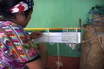 María Estela Puac Tzunun, 17, a resident of rural Chuculjuyup, has been tying  jaspe patterns since she was 12, and now does it from memory rather than following a paper pattern.  Photo by Kathleen Mossman Vitale 2005.