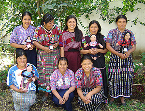 Doll makers for Maya Traditions, an artisan organization located in Panajachel, come in from outlying communities to work for pay on the popular export item.  They also get automatic inclusion in Oxlajuj B'atz'' an educational project sponsored jointly by Maya Traditions and Mayan Hands.  Photo by Denise Gallinetti 2005.