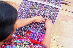 Vicenta Bocel Morales weaves a Solola-style huipil panel in the family compound in El Adelanto. Photo by Kathleen Mossman Vitale 2005.
