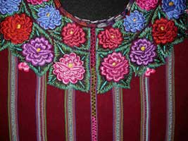 This Patzún-style huipil was woven in 2005 by Gregoria Rucuch Cumes.  She used a back strap loom to weave the burgundy fabric, and then had the neck cut out and hand embroidered.  Photo by Kathleen Mossman Vitale 2005.