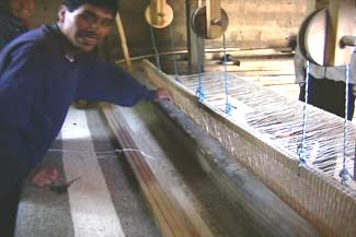 The family's huge floor loom isused to weave large woolen blankets, which are subsequently shrunk or felted.  Photo by Kathleen Mossman Vitale 2005.