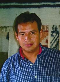 Jesus Ajanel Vicente runs a shop in Panajachel that specializes in wool products from Momostenango where he was raised.  Photo by Paul G. Vitale 2005.
