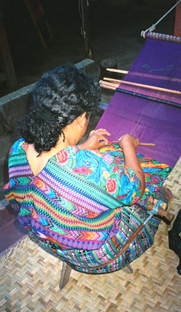 Esperanza Lopez uses a pick for supplementary weft brocading as she works on a huipil or blouse panel in the style of San Antonio Aguas Calientes, her community.  Photo by Margot Blum Schevill 2005.