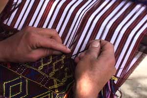 Elena Domingo Mejía weaves a huipil panel with supplementary weft brocade designs in the style of her community, San Rafael Petzal, in Huehuetenango.  Photo by Kathleen Mossman Vitale 2005.