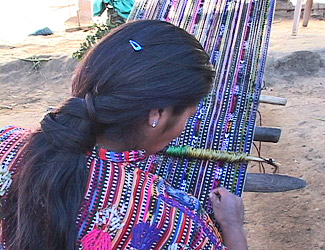 Juana Sicajau Gueraca weaves a panel for a huipil in her family's rural Sololá compound.  Photo by Kathleen Mossman Vitale 2005.