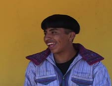 Sporting the latest mushroom haircut while wearing the men's traje of Todos Santos, Santiaga Mendoza Pabla's son William, 17, is a mix of modernity and tradition, which he is clearly comfortable with.  Photo by Kathleen Mossman Vitale 2005.