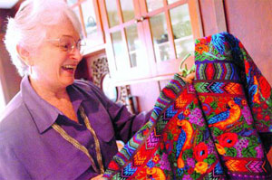 DOCUMENTARY VIDEOGRAPHER Kathleen Mossman Vitale is delighted to show a huipil (blouse) woven by Esperanza Lopez in San Antonio Aguas Calientes, Sacatepequez, Guatemala. (Times-Herald file photo)